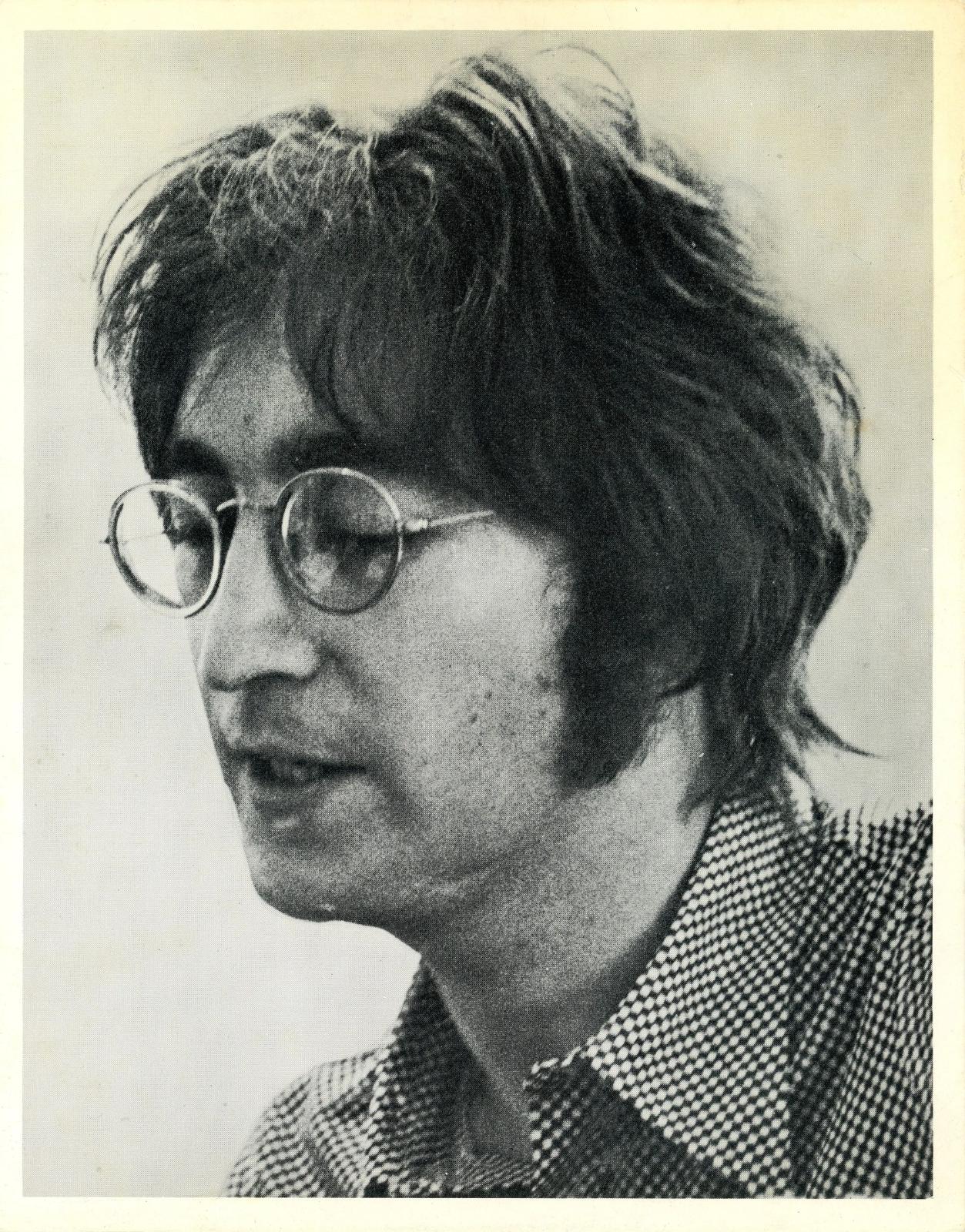 An original cardstock photograph of John Lennon during an interviewed with journalist Steve Turner