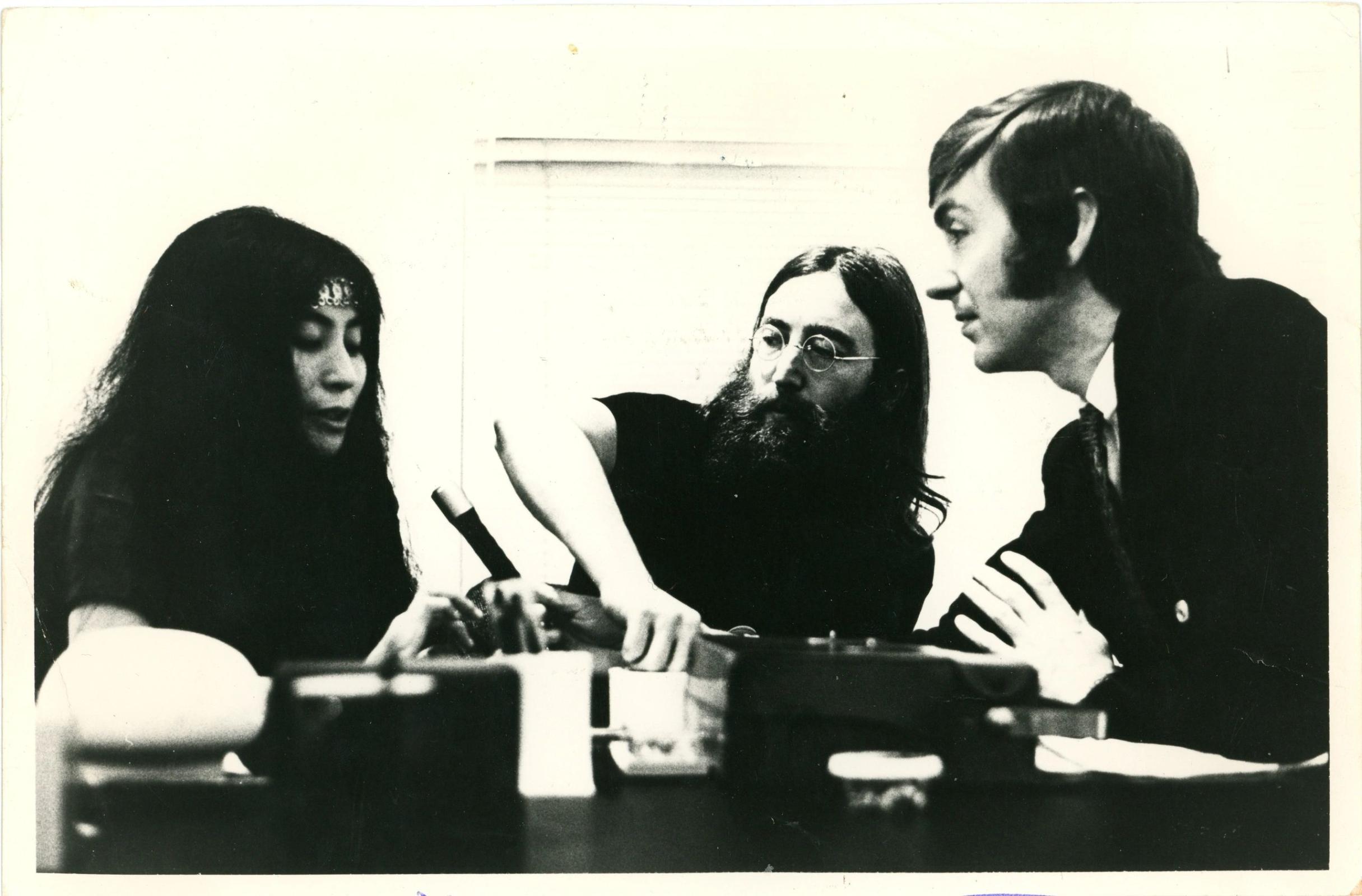 An original press photograph of John Lennon and David Wiggs during the Beatles tapes recordings 1969