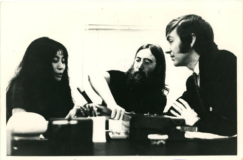 An original press photograph of John Lennon and David Wiggs during the Beatles tapes recordings 1969