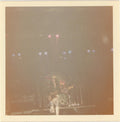 Vintage snapshot of Queen on stage 24th December 1975