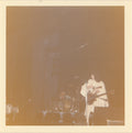 Vintage snapshot of Queen on stage 24th December 1975